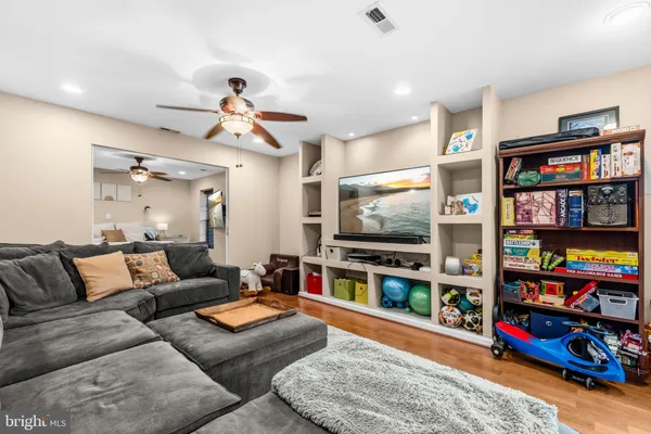a living room with lots of furniture and a flat screen tv