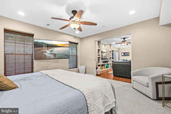 a bedroom with a bed and dresser