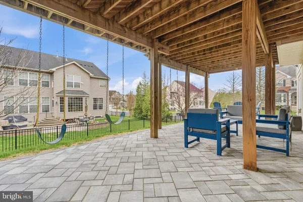 a house view with a sitting space and garden space