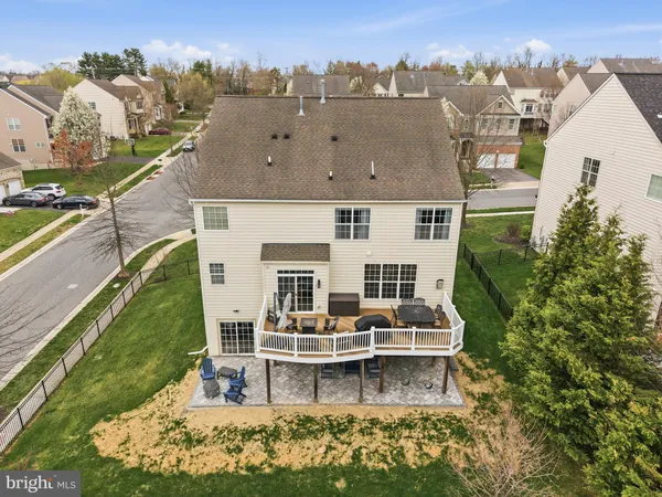 a view of a swimming pool with an outdoor seating
