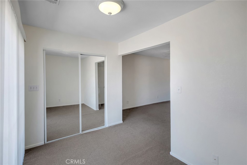 12736 Oasis Road Pinon Hills, CA 92372 - Photo 20 of 33 a view of an empty room with window