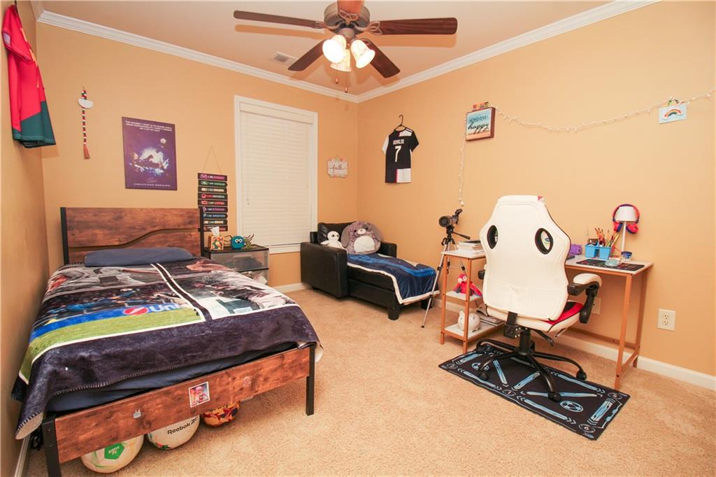 2508 Morgan Chase Drive Buford, GA 30519 - Photo 16 of 23 a bedroom with furniture and a wooden floor