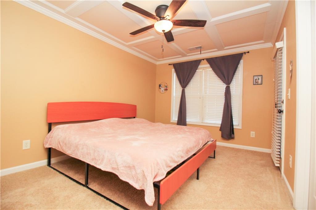 2508 Morgan Chase Drive Buford, GA 30519 - Photo 17 of 23 a bed sitting in a bedroom next to a window