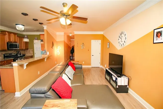 a living room with furniture and flat screen tv