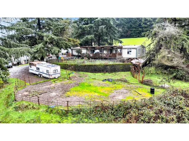 a view of a park with iron fence