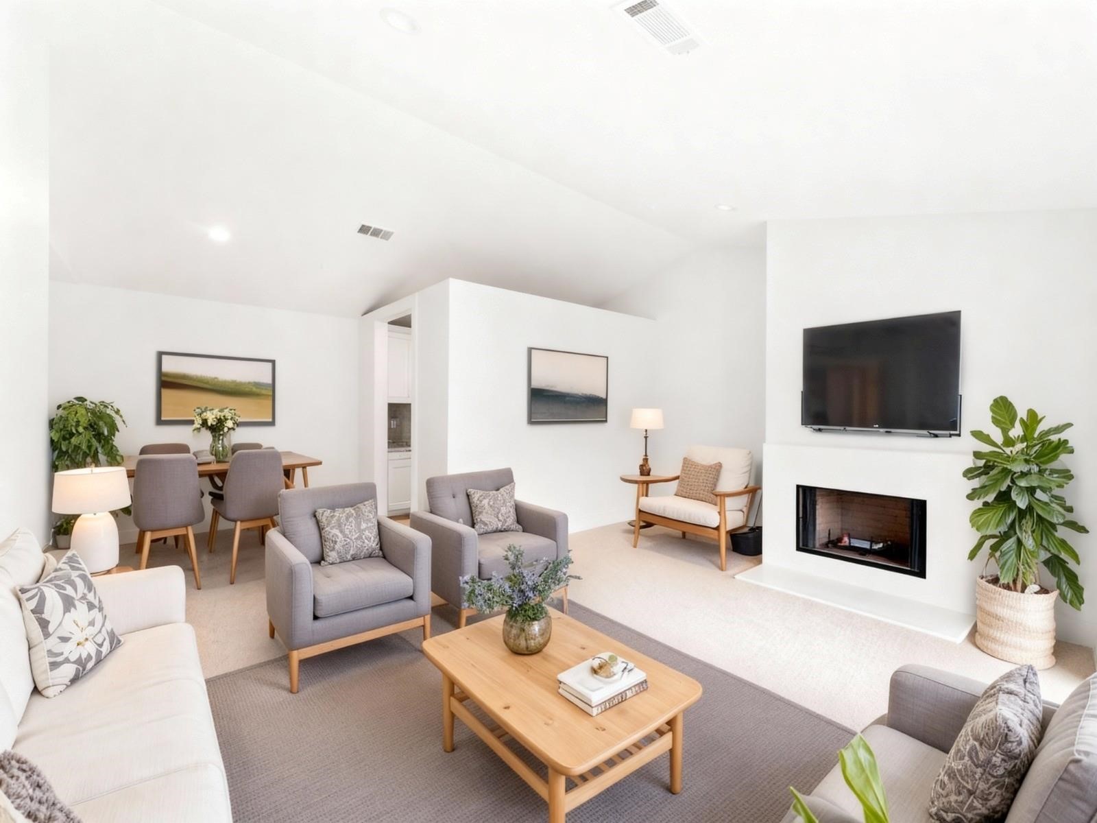 2829 Timmons Lane, Unit 202 Houston, TX 77027 - Photo 3 of 16 a living room with furniture a flat screen tv and a fireplace