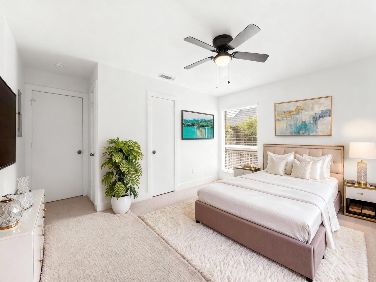 2829 Timmons Lane, Unit 202 Houston, TX 77027 - Photo 10 of 16 a bedroom with a bed potted plant and a window