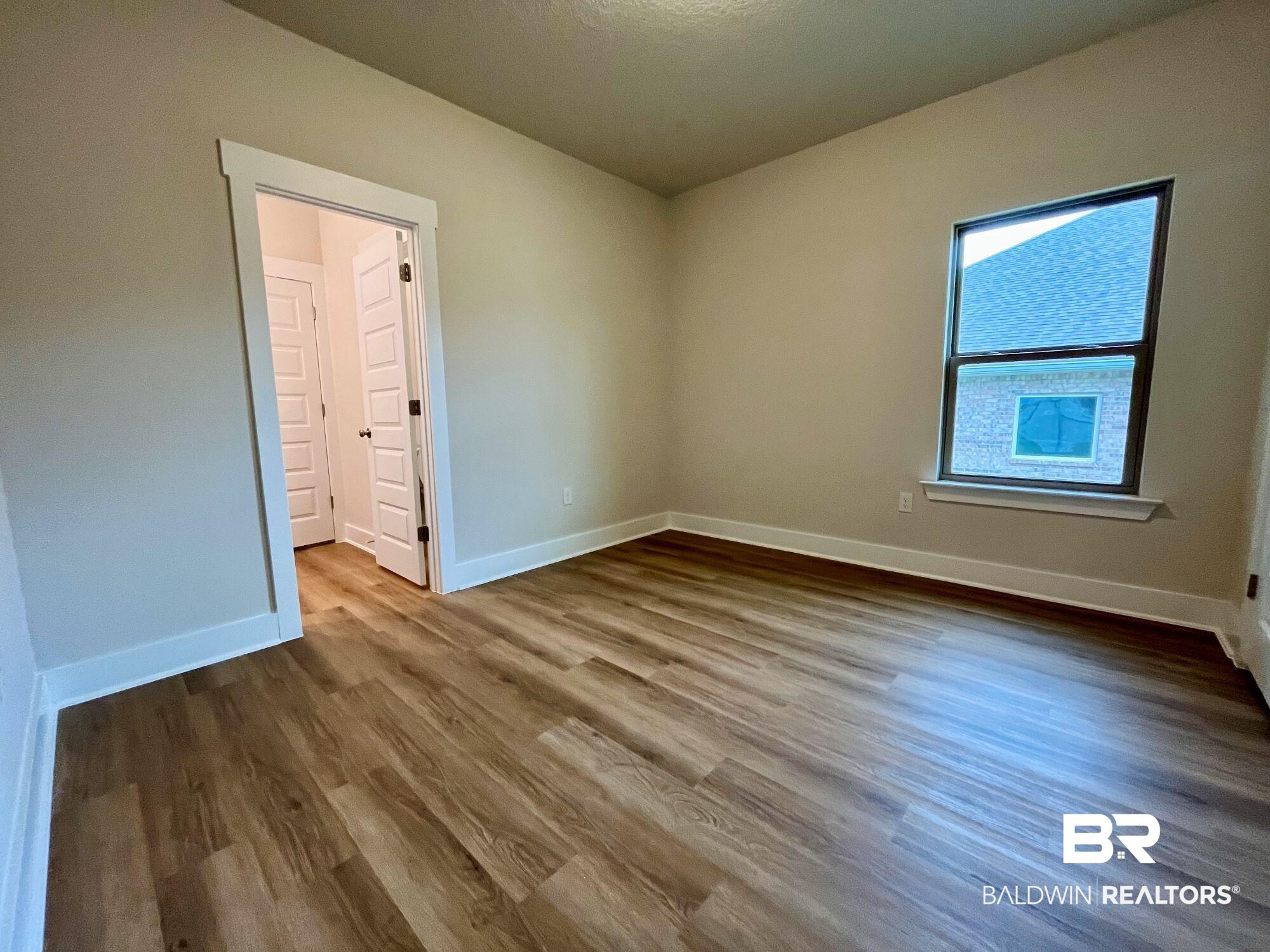 330 Barndling Street Fairhope, AL 36532 - Photo 17 of 31 Empty room featuring hardwood / wood-style flooring