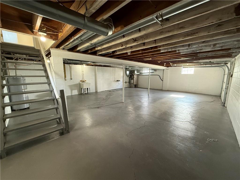 1433 Jones Street Monessen, PA 15062 - Photo 16 of 19 a view of an empty room with stairs