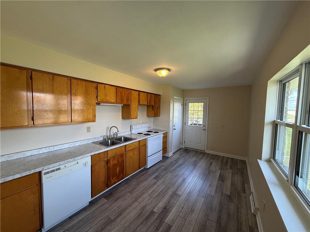 1433 Jones Street Monessen, PA 15062 - Photo 7 of 19 a large kitchen with a wooden floor and large window