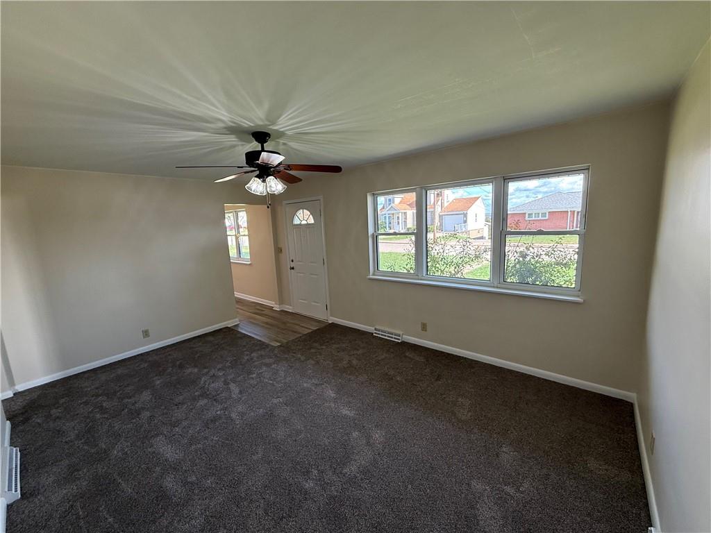 1433 Jones Street Monessen, PA 15062 - Photo 10 of 19 an empty room with a window and a fan