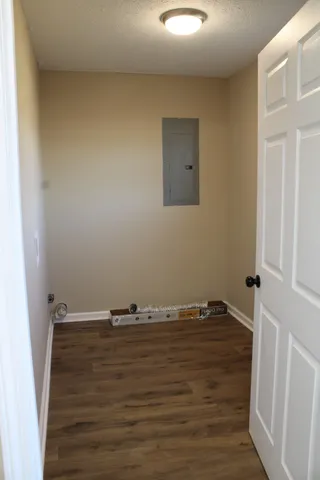 a view of room with wooden floor