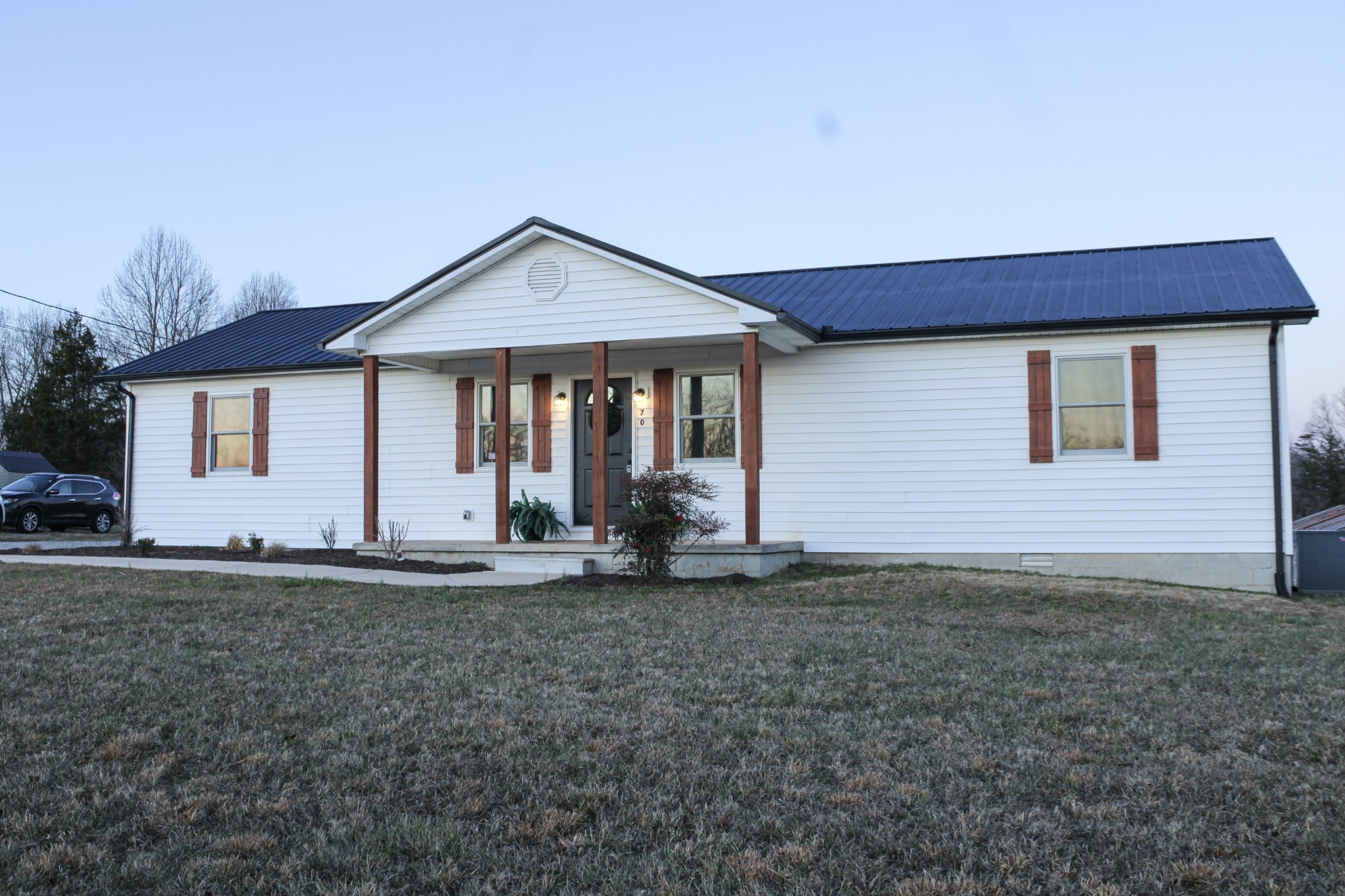 705 County House Road Sparta, TN 38583 - Photo 2 of 28 a front view of a house with a yard