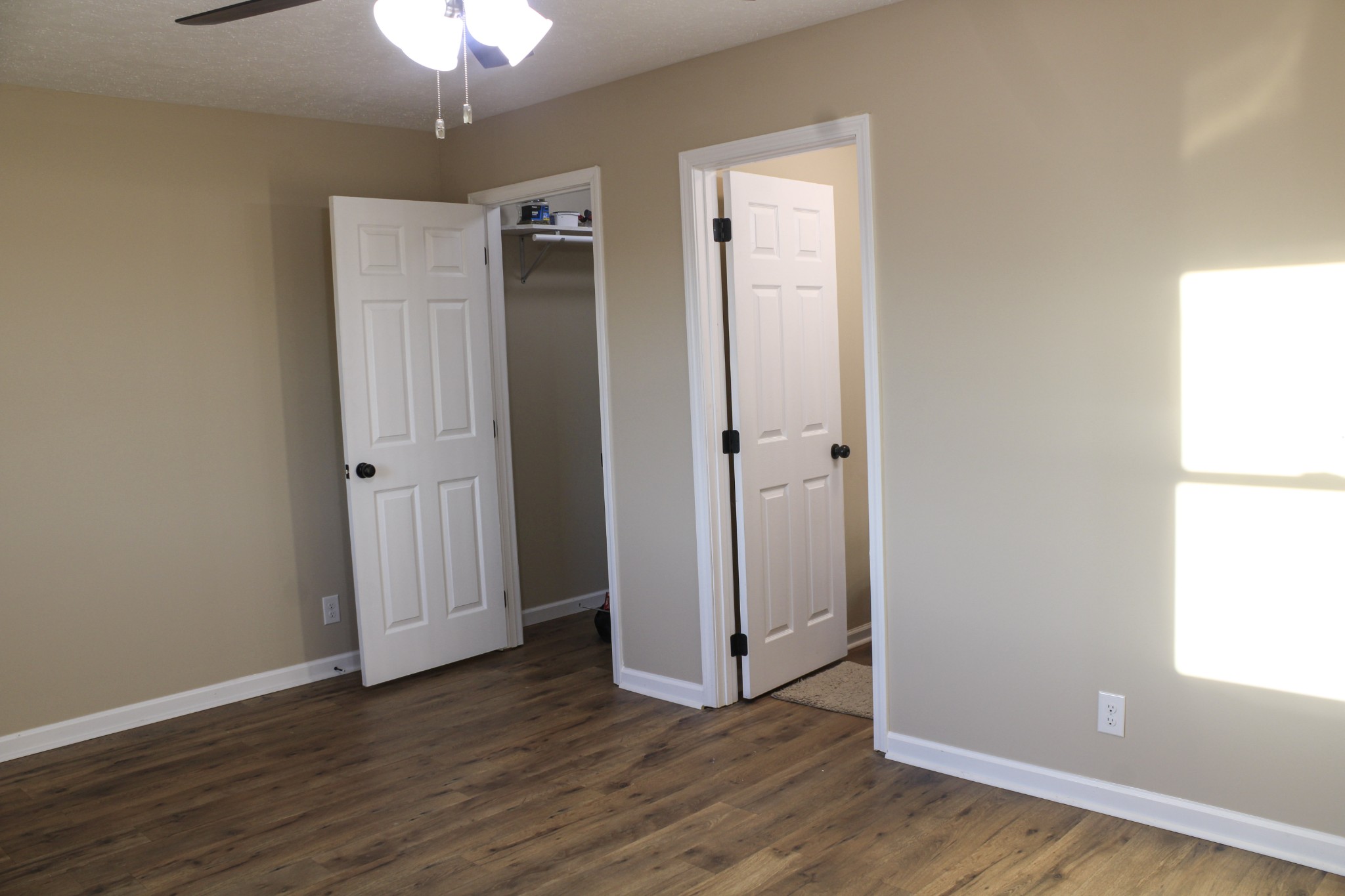 705 County House Road Sparta, TN 38583 - Photo 21 of 28 an empty room with wooden floor cabinet and windows