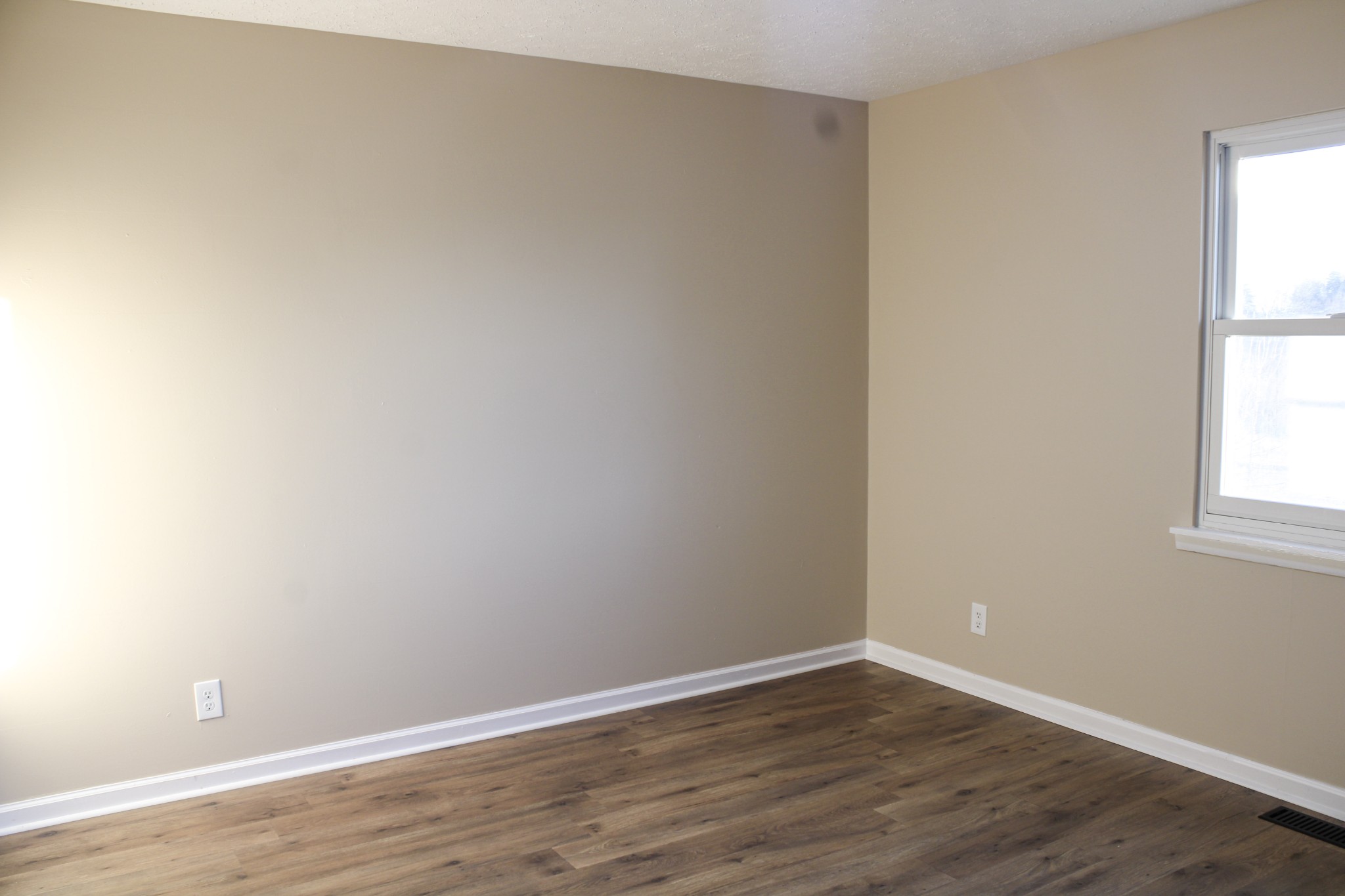 705 County House Road Sparta, TN 38583 - Photo 23 of 28 a view of an empty room with wooden floor and a window