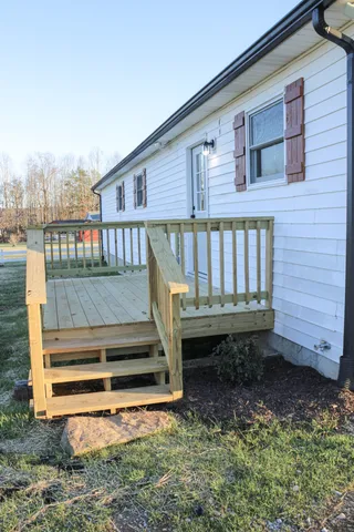 a view of a backyard with sitting area