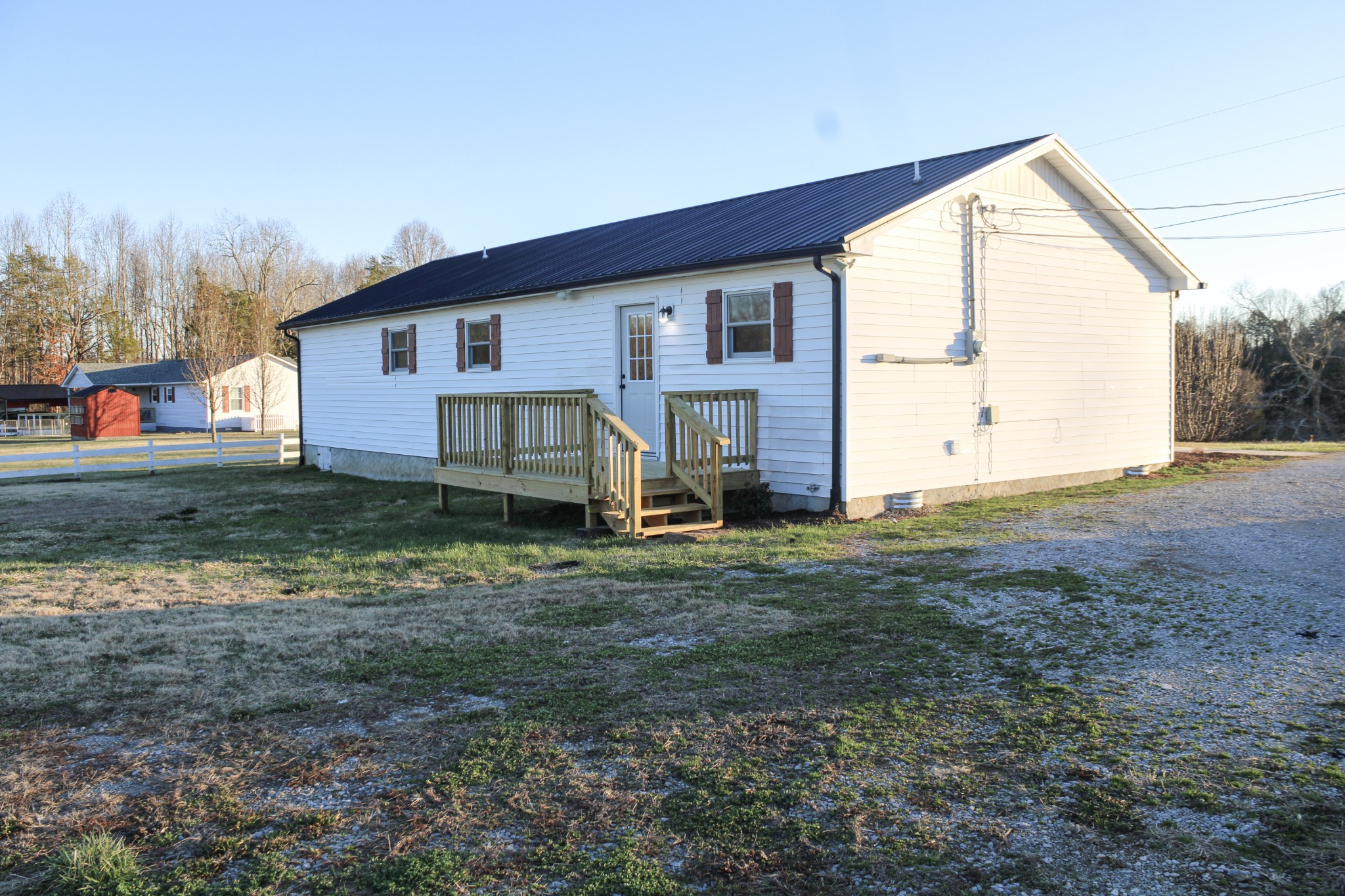 705 County House Road Sparta, TN 38583 - Photo 26 of 28 a view of a house with backyard and trees