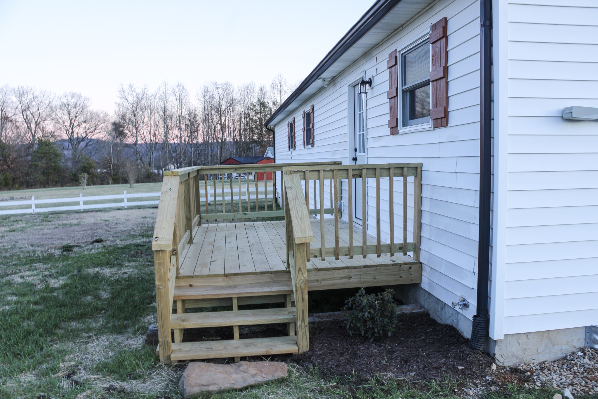 705 County House Road Sparta, TN 38583 - Photo 28 of 28 a view of a wooden deck with a bench
