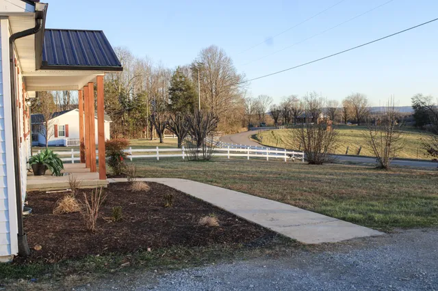 a view of a swimming pool with a patio