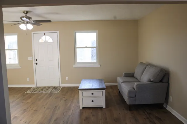 a living room with furniture and a window