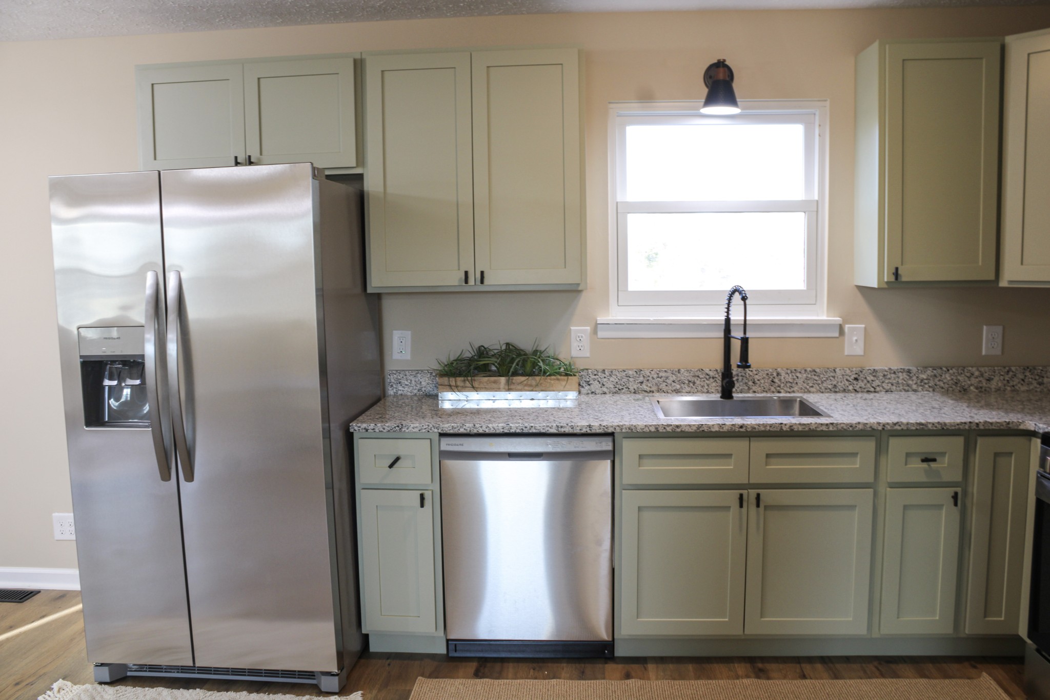 705 County House Road Sparta, TN 38583 - Photo 8 of 28 a kitchen with stainless steel appliances granite countertop a refrigerator a sink a stove a microwave and island