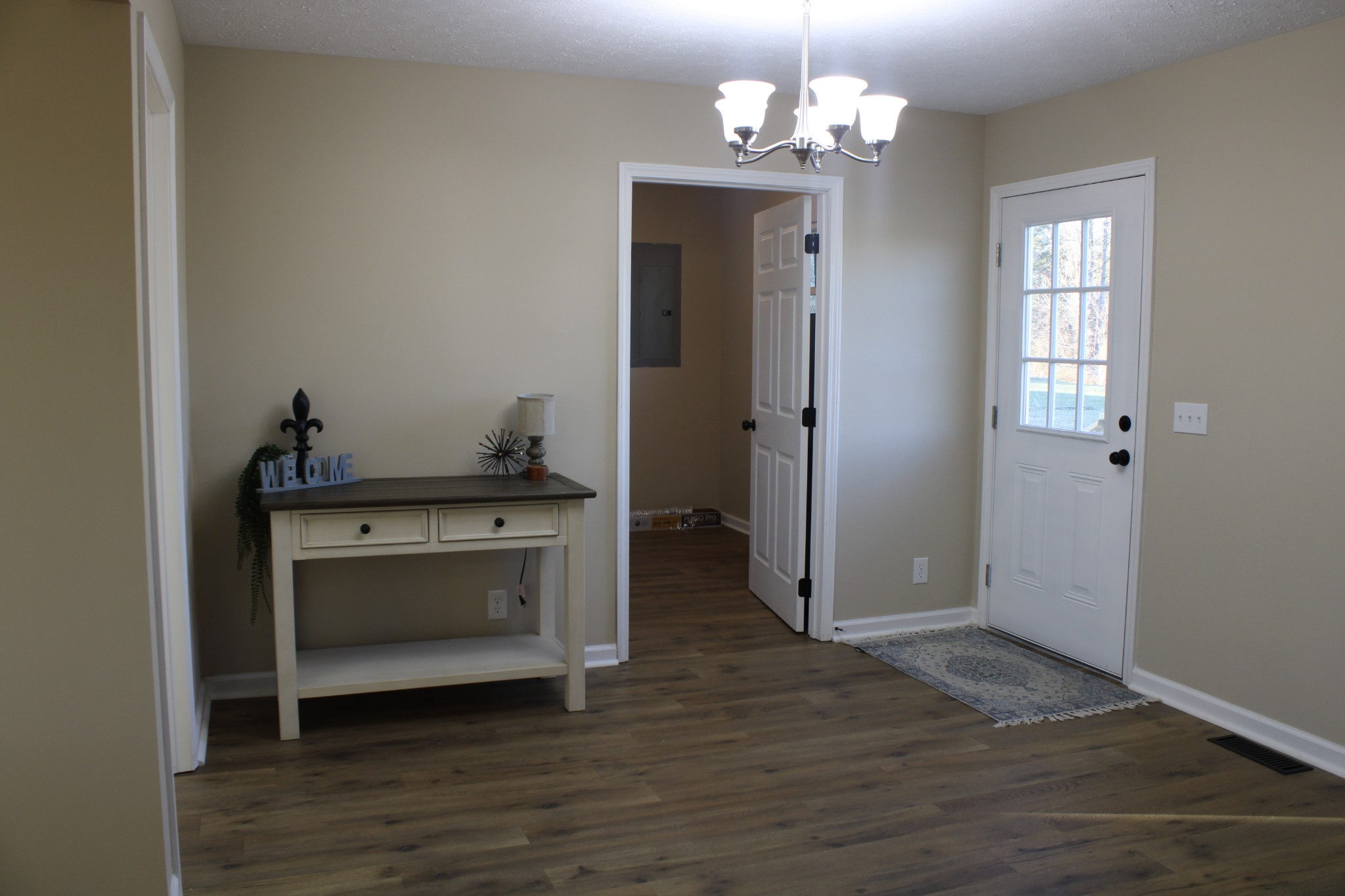 705 County House Road Sparta, TN 38583 - Photo 10 of 28 a view of a hallway with wooden floor and a cabinet