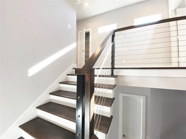 a view of a hallway with staircase