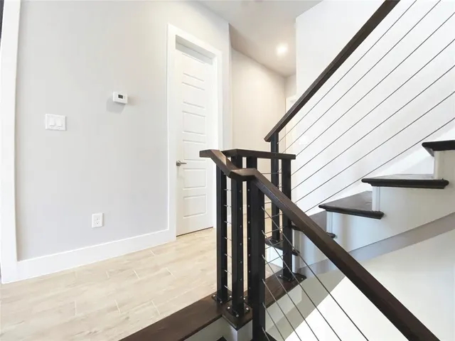 a kitchen with stainless steel appliances a stove a sink and a microwave