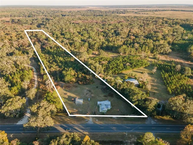 an aerial view of residential house with outdoor space