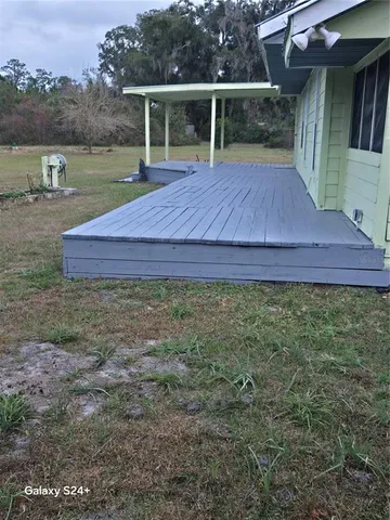 a small yard with wooden fence