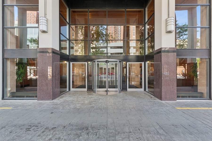 1122 North Clark Street, Unit 1002 Chicago, IL 60610 - Photo 1 of 14 a view of a building with a large window