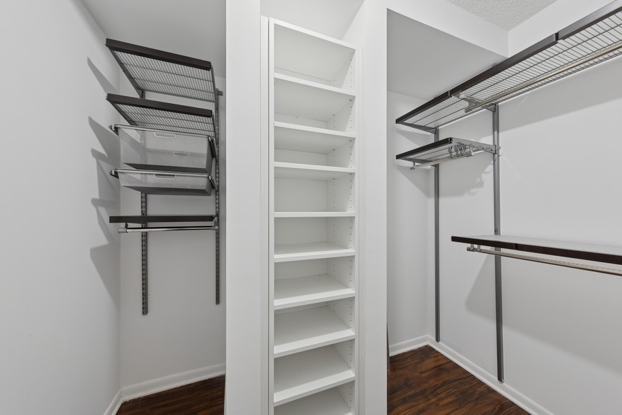 1122 North Clark Street, Unit 1002 Chicago, IL 60610 - Photo 14 of 14 a view of walk in closet with empty racks
