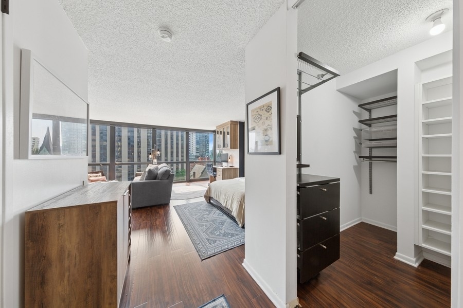 1122 North Clark Street, Unit 1002 Chicago, IL 60610 - Photo 10 of 14 a view of a living room and a couch