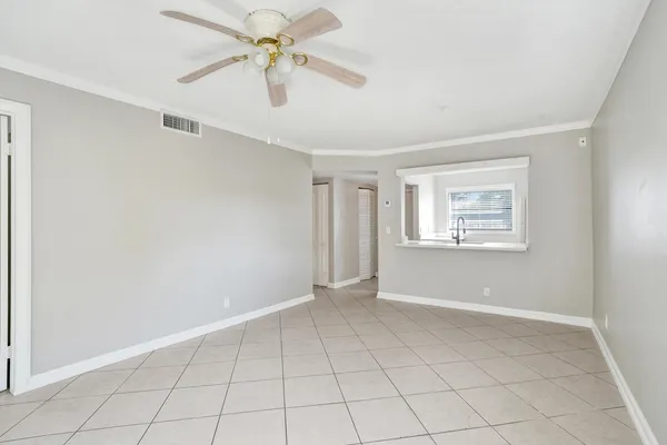 a view of an empty room with a window