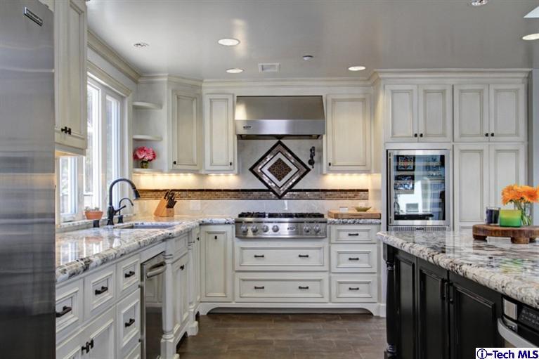 532 Alhambra Road San Gabriel, CA 91775 - Photo 12 of 28 a kitchen with granite countertop a sink stainless steel appliances and cabinets
