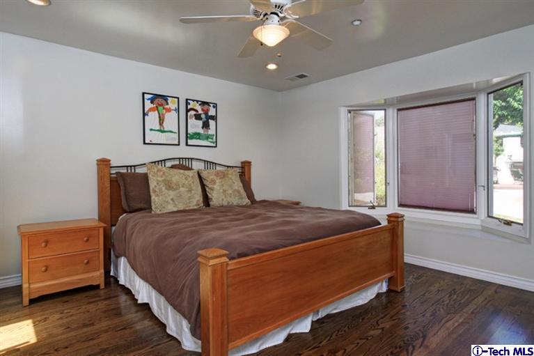 532 Alhambra Road San Gabriel, CA 91775 - Photo 14 of 28 a bedroom with a bed and wooden floor