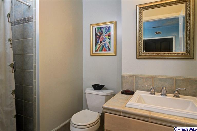 532 Alhambra Road San Gabriel, CA 91775 - Photo 20 of 28 a bathroom with a toilet sink and mirror