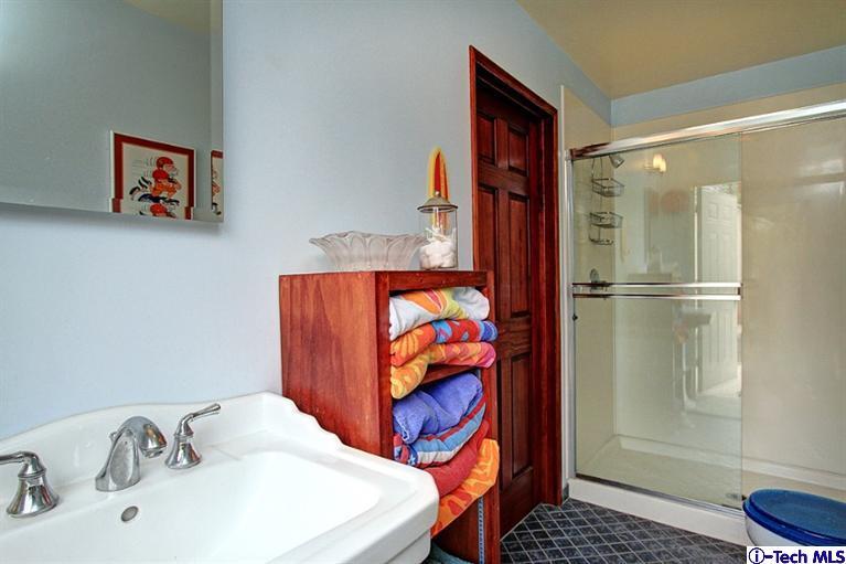 532 Alhambra Road San Gabriel, CA 91775 - Photo 23 of 28 a bathroom with a sink and a mirror