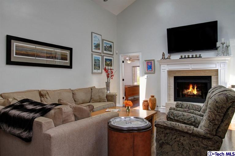 532 Alhambra Road San Gabriel, CA 91775 - Photo 7 of 28 a living room with furniture a flat screen tv and a fireplace