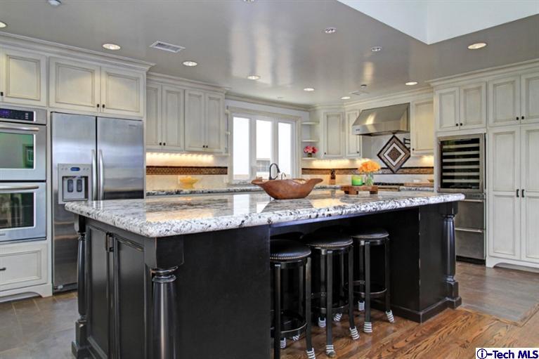 532 Alhambra Road San Gabriel, CA 91775 - Photo 9 of 28 a kitchen with granite countertop kitchen island stainless steel appliances a sink stove and refrigerator
