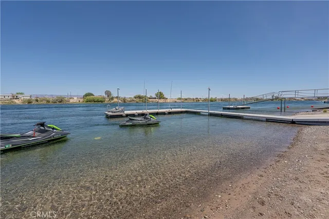 a view of a lake with boats and trees