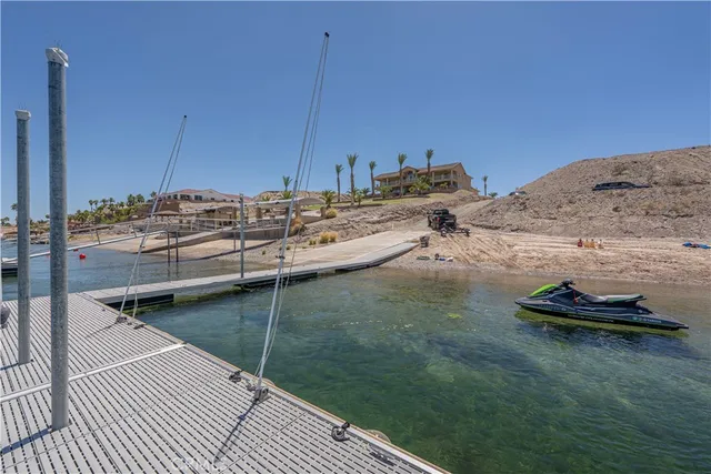 a view of a lake with beach and city view