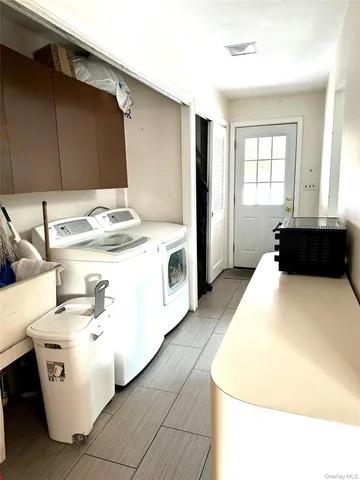 a kitchen with a stove and a refrigerator