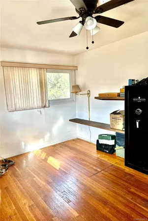 a view of a livingroom with wooden floor