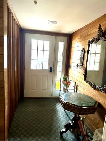 a view of a dining room with furniture and window