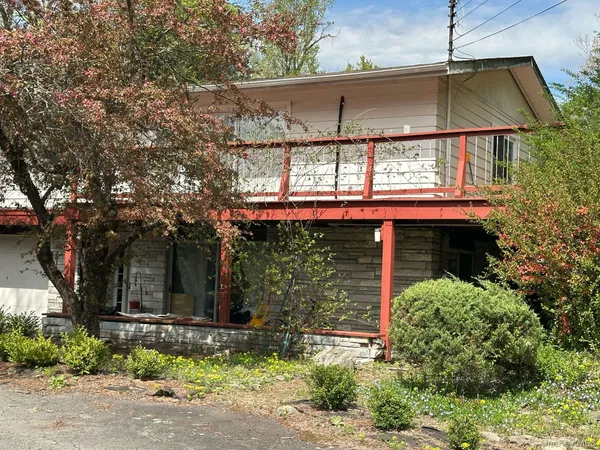 a view of a house with a small yard