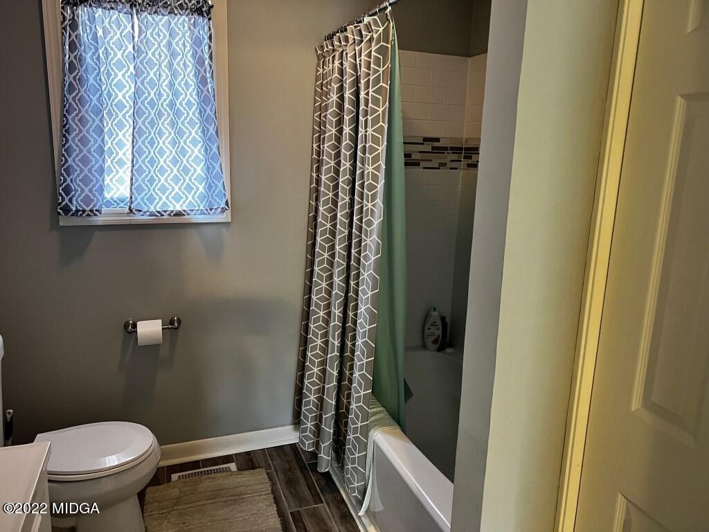398 Old Benton Road Juliette, GA 31046 - Photo 20 of 31 a bathroom with a toilet and a shower