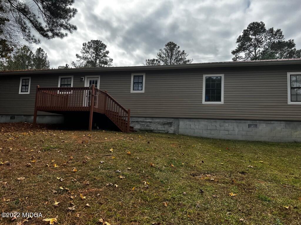 398 Old Benton Road Juliette, GA 31046 - Photo 2 of 31 a view of a house with a backyard