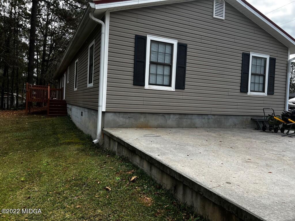 398 Old Benton Road Juliette, GA 31046 - Photo 3 of 31 a view of a house with a backyard