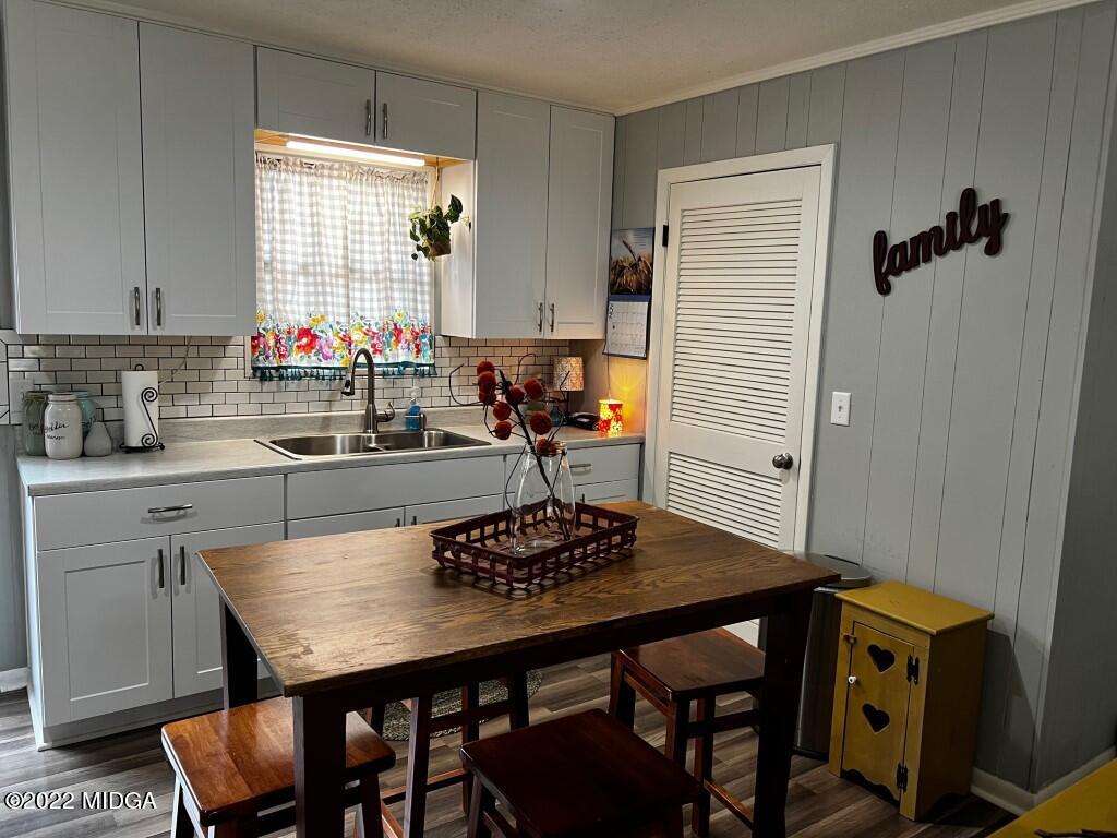 398 Old Benton Road Juliette, GA 31046 - Photo 10 of 31 a kitchen with a table chairs and a refrigerator